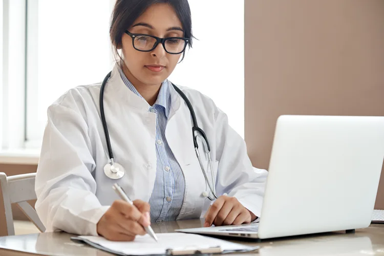 A health professional writing an ESA letter after providing a telehealth assessment session